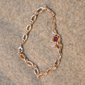 9 inch Long Bracelet with Red Stone and Some Clear Rhinestone.